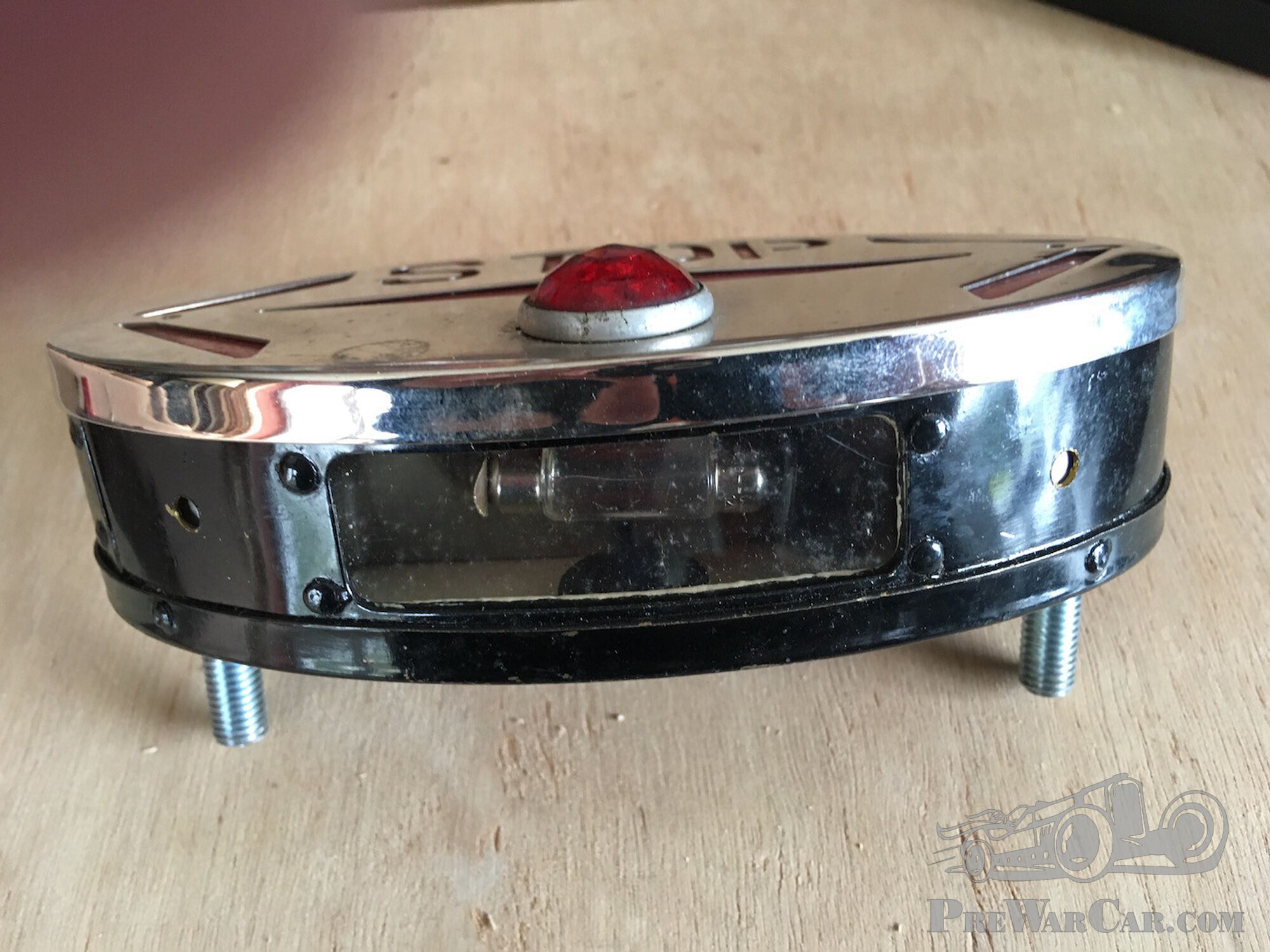 Combination trafficators-stop-number plate light unit