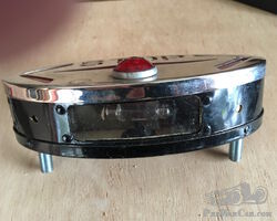Combination trafficators-stop-number plate light unit