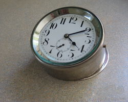 Edwardian or Early Vintage Nickle plated car clock complete with angled mount