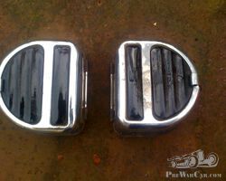 A pair of lucas D shaped rear lights.