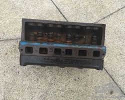 Austin Seven engine block with head and waterpipe