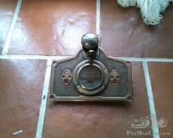 small dashboard in bronze with ammeter