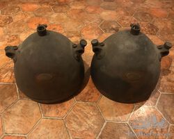 Two brass Brolt headlamps