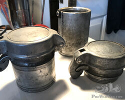 A pair of vintage aluminium flip top fuel/petrol caps with filler necks