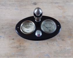 small electric board with ammeter and Oil pression in perfect working condition