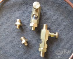 OIL FEED VALVES FOR SUPERCHARGERS.