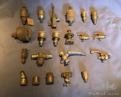 Collection of brass grease nipples, fuel and air valves