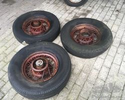 Three mid 1930s Cadillac wheels