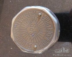 A Rare Early Rudge Whitworth Brass Threaded Hubcap with SRB Center Medallion