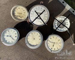 lot of speedo and jaeger clocks