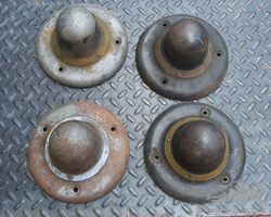 A set of four 1914-1918'ish REO wheel center hub covers /hubcaps