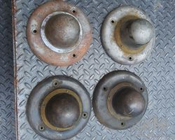 A set of four 1914-1918'ish REO wheel center hub covers /hubcaps