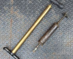 A Nice Early Brass Tire Pump and Early Grease Gun