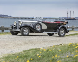 1932 Duesenberg Model J 'Sweep Panel' Dual-Cowl Phaeton | The Quail Auction | Bonhams