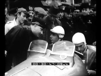 Painting rally numbers on the car ― Mille Miglia