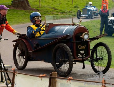 Hillclimb racer ends in back of family car