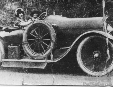 Unknown make of car and unknown ladies