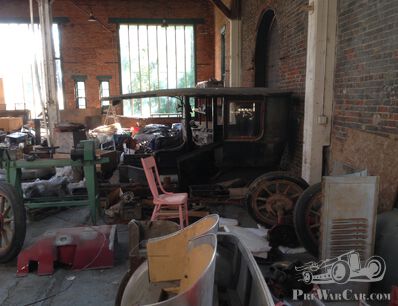 Two more old automobile bodies needing identification.