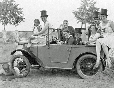 A 8-seater Austin Chummy with a roadblock