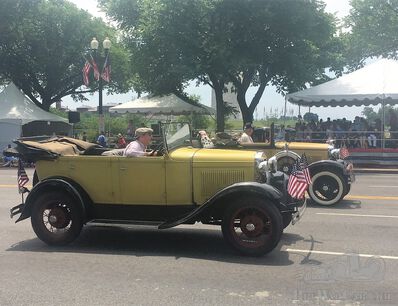Pre-war cars parading on the Fourth of July