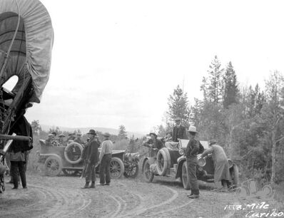Freight wagons and automobiles at 153 Mile House