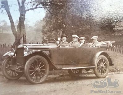 Four laid back men in a Mystery Car