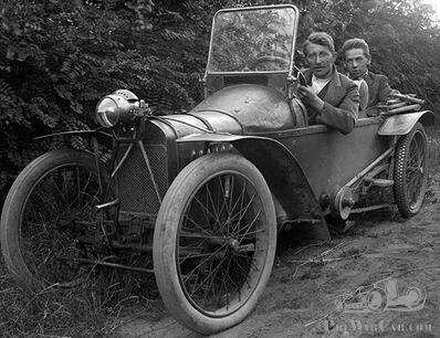 Two young men in an unidentified cyclecar