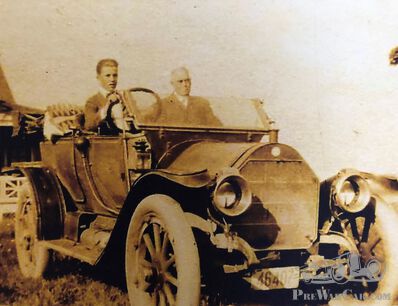 What car is this young man driving?