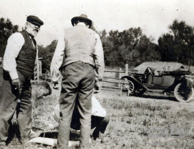 What is that big beautiful brass era roadster in Richter's orchard?