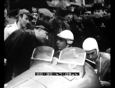 Painting rally numbers on the car ― Mille Miglia