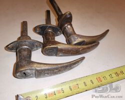 3 unidentified door handles