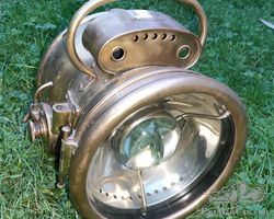 Phare cuivre autogenerateur marque ECLA pour ancetre
