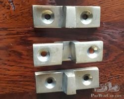 Pair of brass door closing parts