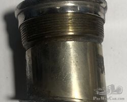 Small angled nickel radiator cap and neck. 2" diameter.