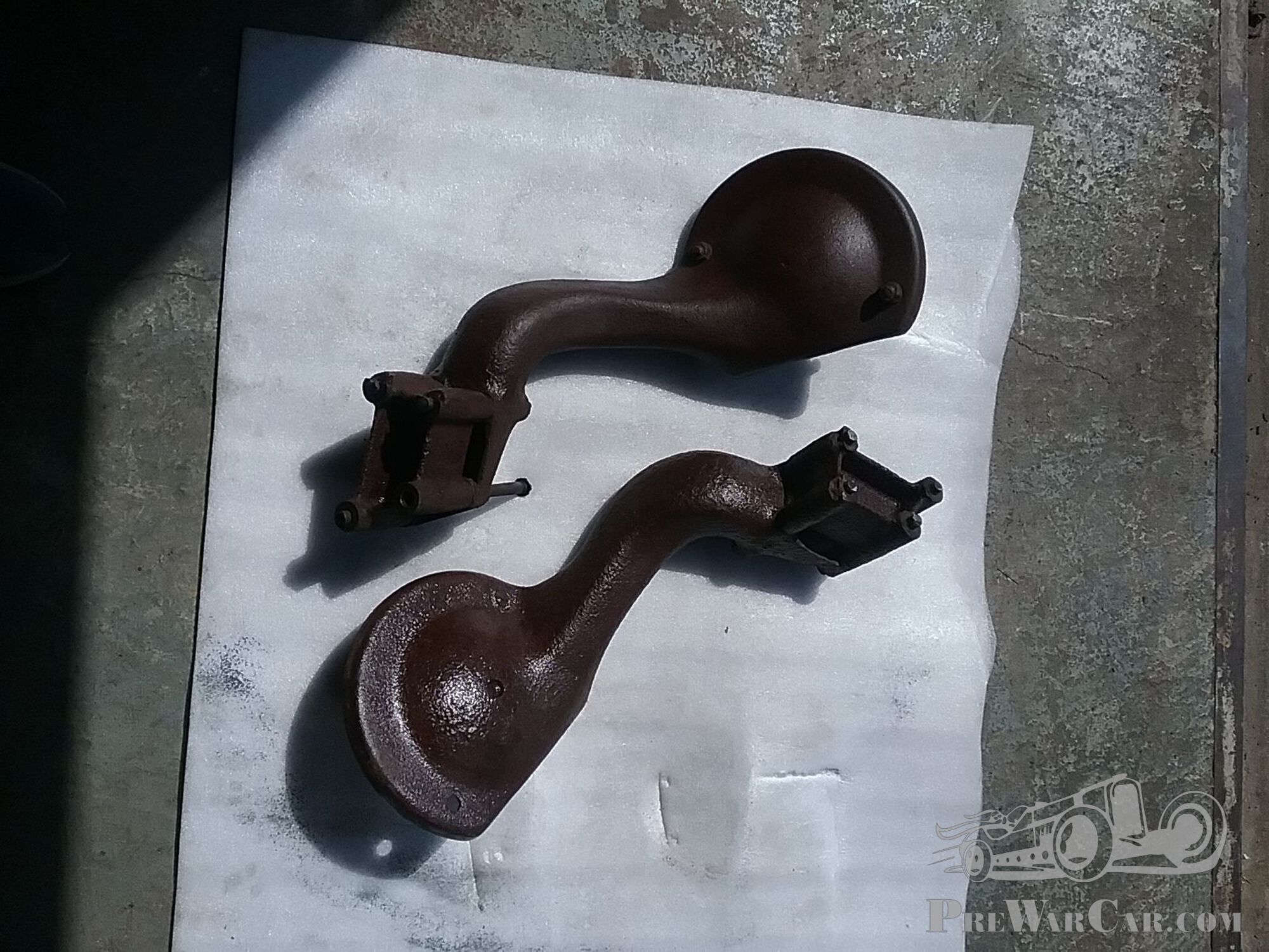 Pair of heavy sidemounts for spare wheels of circa 1933 Packard