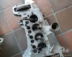 Austin Seven crankcase with crankshaft , conn rods , flywheel and crankhandle neck