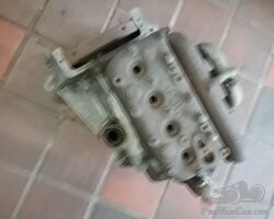 Austin Seven engine with manifolds, flywheel, head and oilpipe