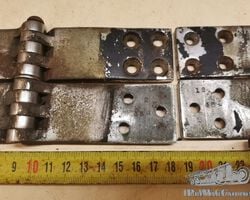 Two unidentified door hinges