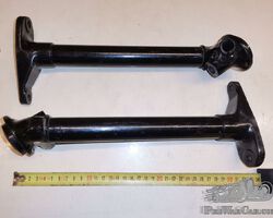 Two unidentified headlight mounts