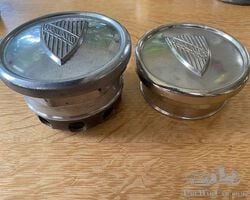 Two hubcaps for the 1920s Oaklands