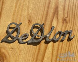 De Dion badge