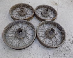Four 19'' Beaded Edge Wire Wheels