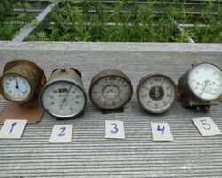 5 brass speedometers and 1 clock