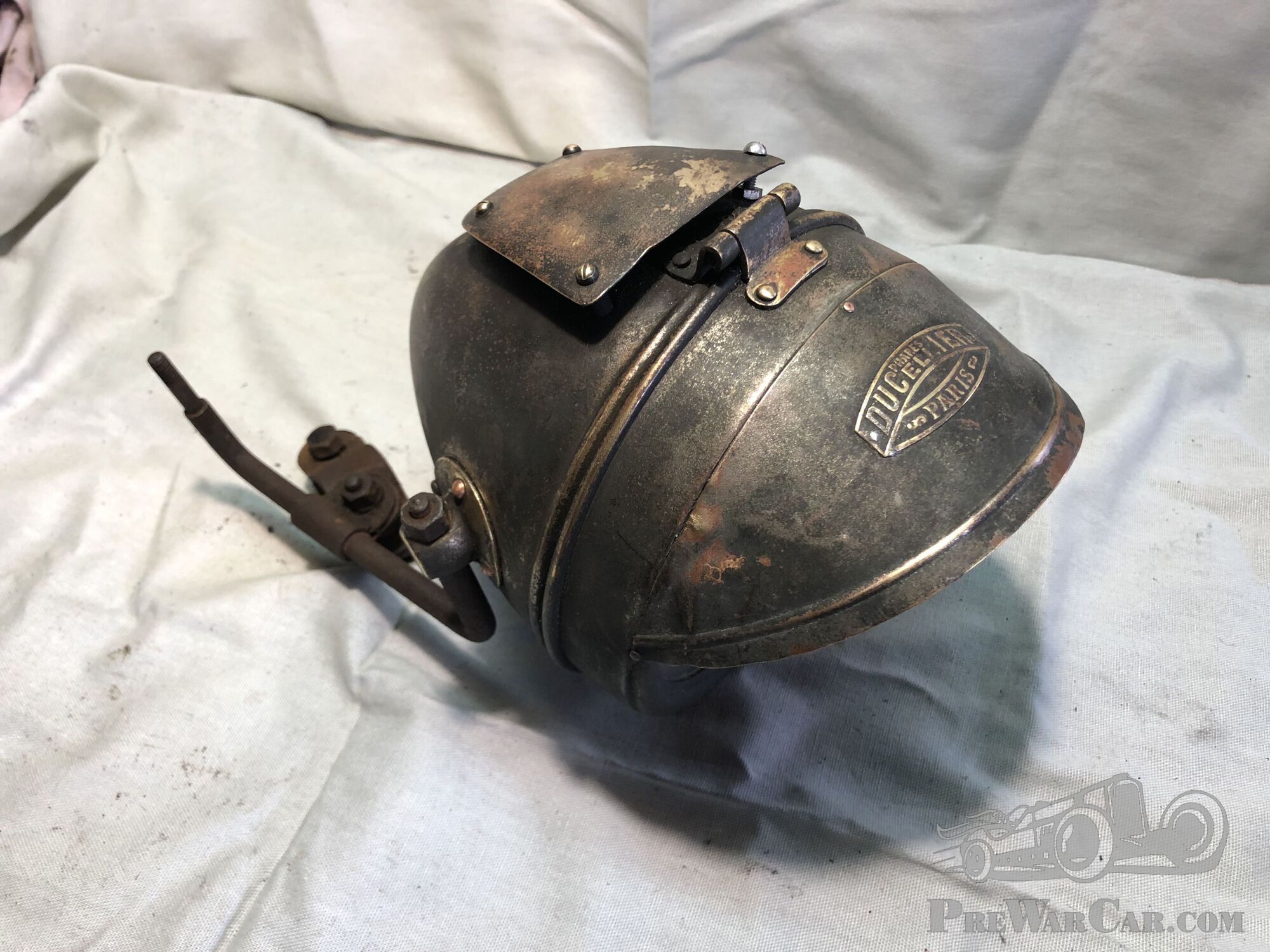 large Ducellier motorcycle headlight.