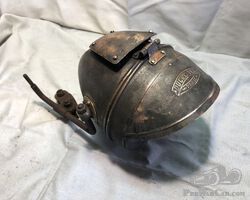 large Ducellier motorcycle headlight.