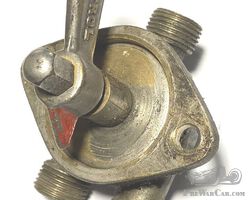 Brass fuel selector tap.