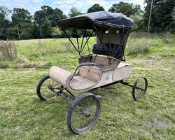 Gene Autry's 1903 Curved Dash Oldsmobile: A rare and historically significant vehicle once owned by Hollywood legend Gene Autry, the singing cowboy.