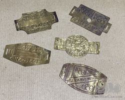 Collection of 5 Brass 1930's Bicycle Tax Plaques
