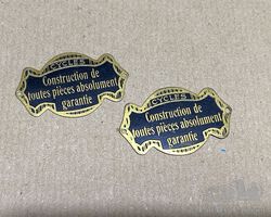 Original Cycles 'Construction de toute pieces absolument garante'. Badges.