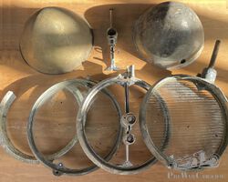 A collection of Marchal 20cm headlamp parts.